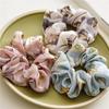 French-style smooth satin scrunchie with floral pattern, versatile elastic hair tie for women, popular on Instagram