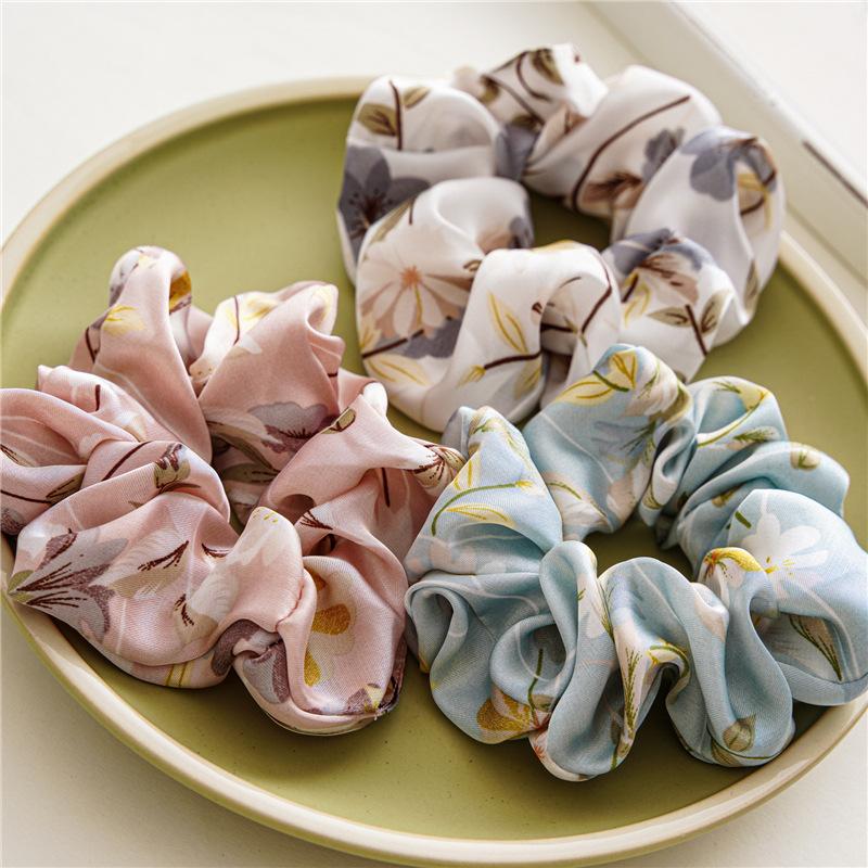 French-style smooth satin scrunchie with floral pattern, versatile elastic hair tie for women, popular on Instagram