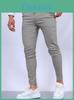 Pantalon slim décontracté pour homme en mélange de coton hautement élastique, idéal pour le streetwear urbain.