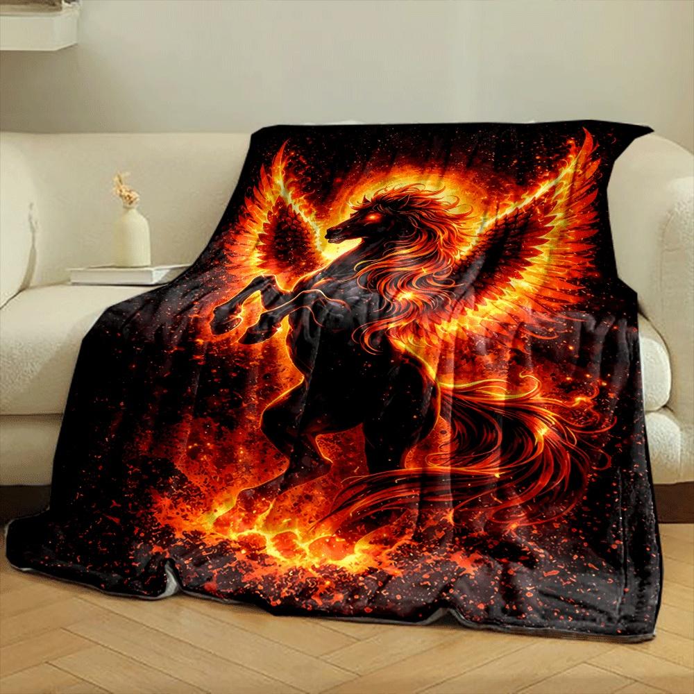 A fiery black-winged horse surrounded by flames and glowing embers. for all seasons blanket lunch break throw gift