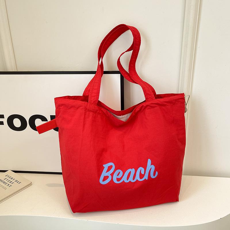 Korean version of the new letter printing bag women's large-capacity nylon shoulder bag casual versatile portable drawstring tote bag