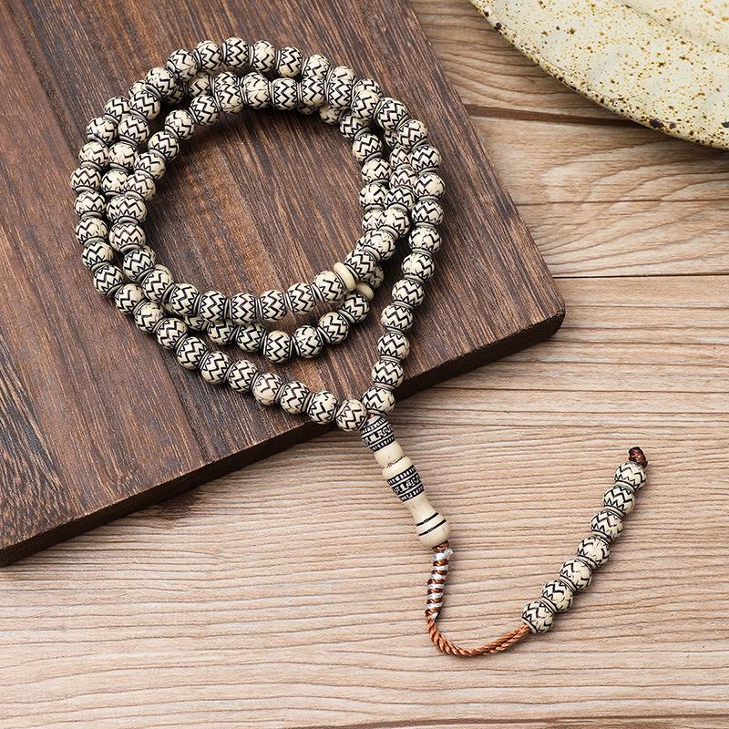 Ručně vyráběný 99-korálkový růženec Tasbih s imitací dřevěné kresby ze Saúdské Arábie