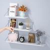 Punch-Free Wall-Mounted Iron Art Storage Rack for TV, Living Room, or Bedroom Décor.