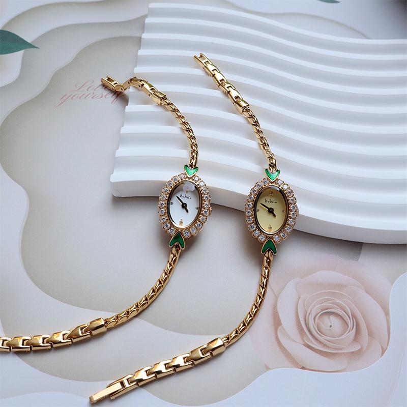 Meerjungfrau Armband Damen Armbanduhr Light Luxury Armbanduhr Mittelalterlich Exquisit Einfach Diamantbeschichtet 18 Karat Gold Smaragd