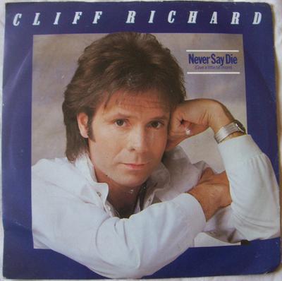 7inch Record CLIFF RICHARD  Never Say Die Give A Little Bit Mo EMI5415 EMI 1983 UK Rock Used