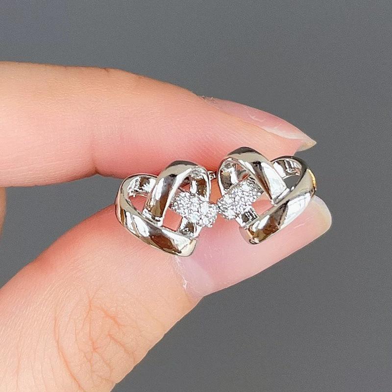 Beixi S999 Sterling Silver Heart Intertwined Stud Earrings – Exquisite, Light Luxury, Versatile Design for Everyday Wear.