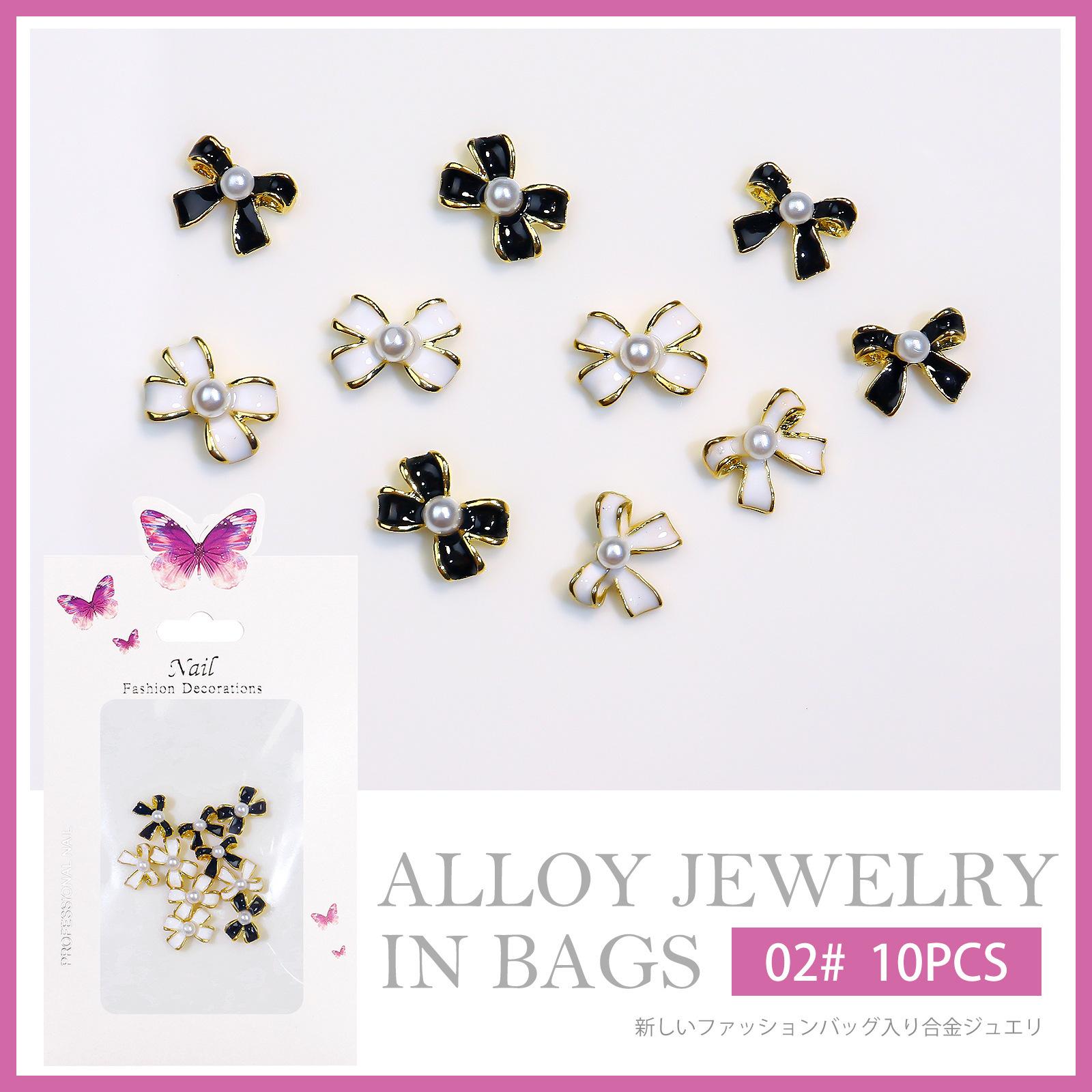 

Интернет-знаменитость Xiaoxiangfeng украшения для ногтей сплав капельное масло жемчужный бант белый черный дрель для ногтей украшение партия бездна