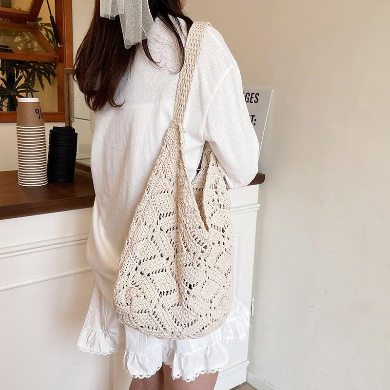 Beautiful flower hollow woven solid color tote bag, new large-capacity shoulder underarm bag, light and versatile bag