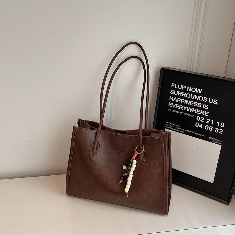 

Autumn and winter new large-capacity tote bag 2025 new women s commuting leisure simple portable shoulder bag separate bag