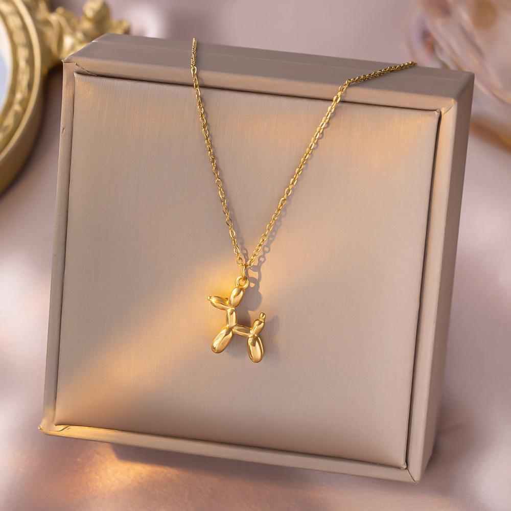Gold-Tone Balloon Dog Pendant: Smooth lines, vivid form, finely polished, comfortable fit, natural color.