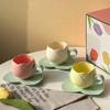 Suits, tulip cups and saucers, flower-shaped ceramic coffee cups and saucers, lovely drink cups.