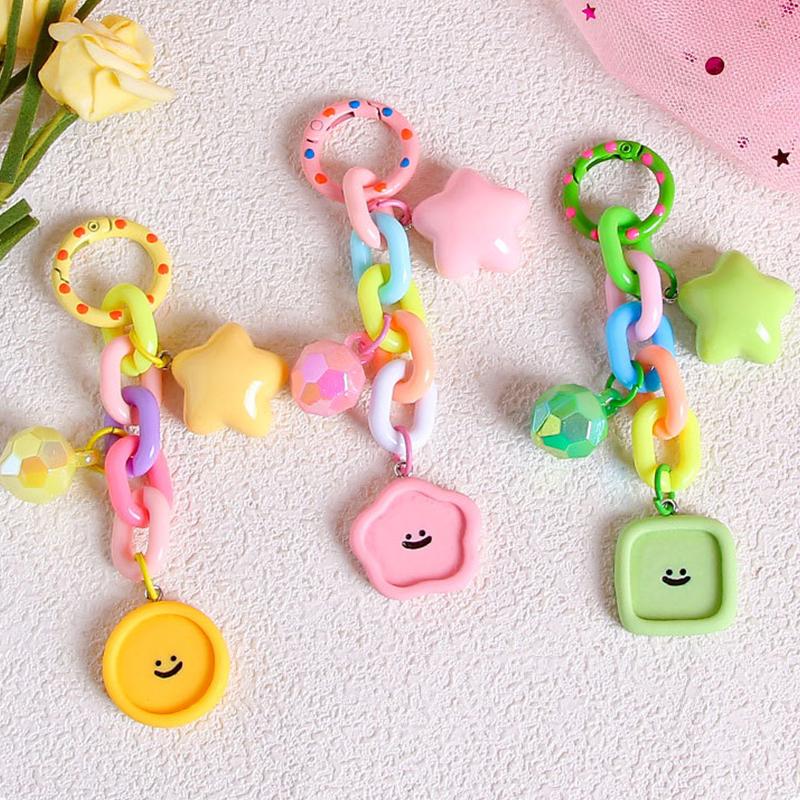 

Креативный брелок-подвеска в виде улыбающегося лица цвета конфет, милый защитный чехол для наушников, подвесная сумка, аксессуары для украшения