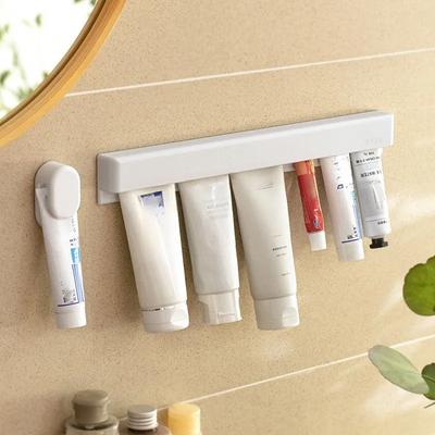 Wandmontierter Zahnpastahalter, Badezimmer Aufbewahrungsregal ohne Bohren Selbstklebend Manueller Squeezer Hänger für Dusche