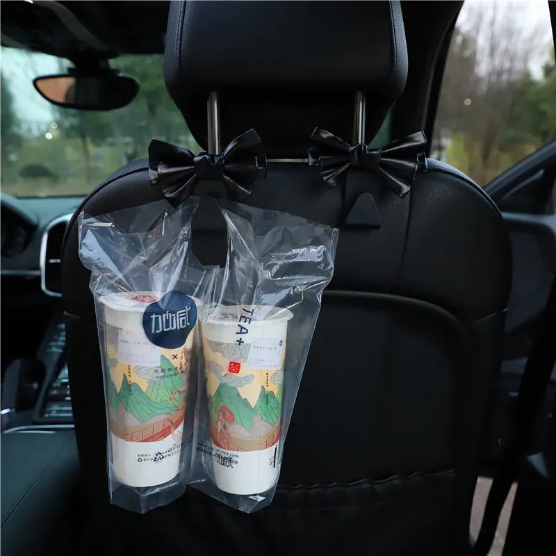 Háček na opěradlo autosedačky Bowknot Úložný háček z PU kůže Módní taška Držák na kabelku Univerzální spony do auta pro autodoplňky