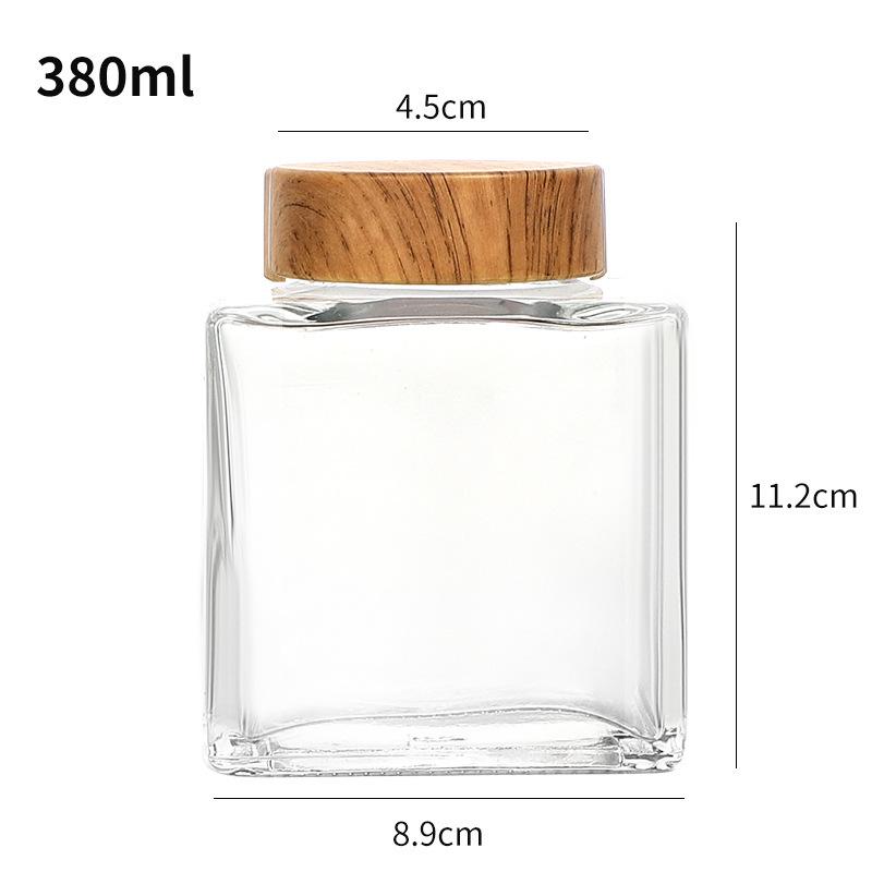 Verdickte flache quadratische Glasflasche mit Holzmaserung für Honig oder Marmelade