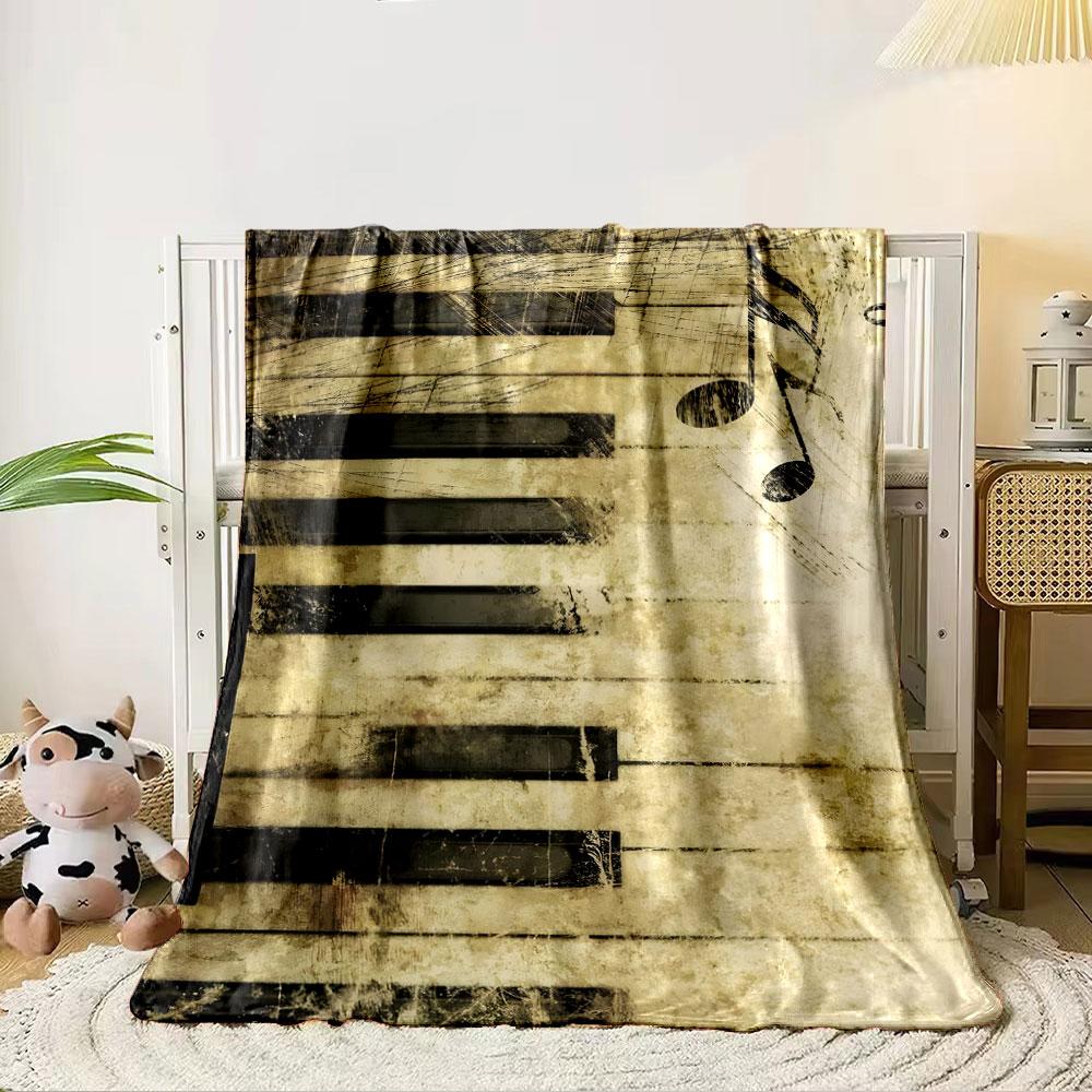 A grunge-styled piano keyboard with scattered musical notes. for all seasons blanket lunch break throw gift 80cm x 120cm