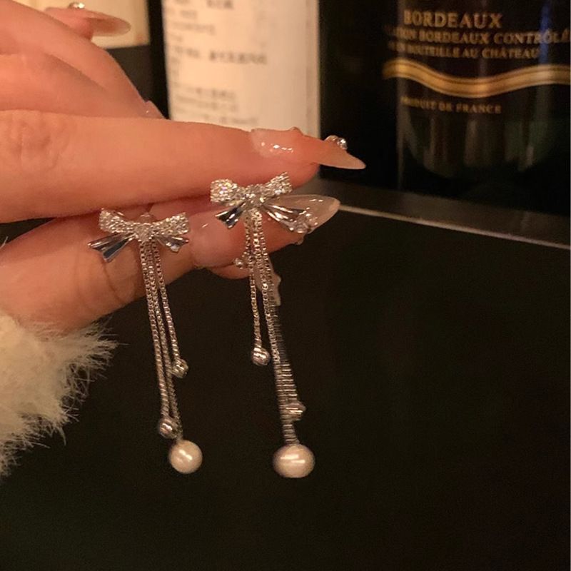 

Pearl Bows Tassel Earrings Sterling Silver Women s Fancy Light Luxury Temperament Long Design Sense Earrings Earrings Ear Clips A pair of ear clips without ear holes