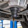 111116RC2B Black Automotive Oil Drain Closure with Two Opposing Grips, Recessed Center Drive, and Round Engineering Plastic Body