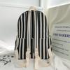 High-value college style striped backpack for junior high school students, casual, simple, lightweight and large-capacity backpack.