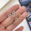 Ornate S999 Pure Silver U-Shaped Horseshoe Stud Earrings with Cubic Zirconia for Women - Fashionable, Simple, and Versatile Jewelry.