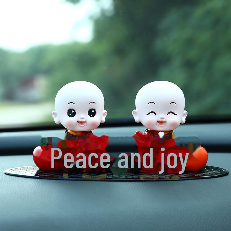 Creative Little Monk Maitreya Buddha Car Ornament: Cute, Shaking Head Resin Doll for Car Interior Decoration and Safety.