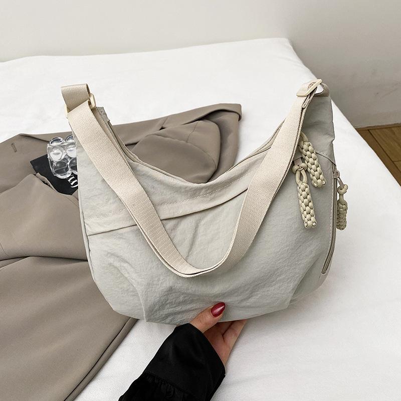 

Nylon cloth bag women s 2025 new high-end texture niche summer versatile large-capacity shoulder crossbody dumpling bag білий
