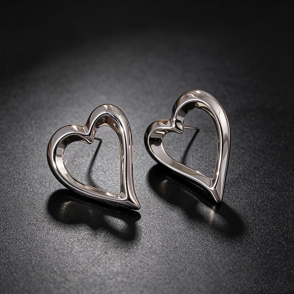 Geometric Hollow Heart Stud Earrings - Retro Design with Light Luxury Style for Women