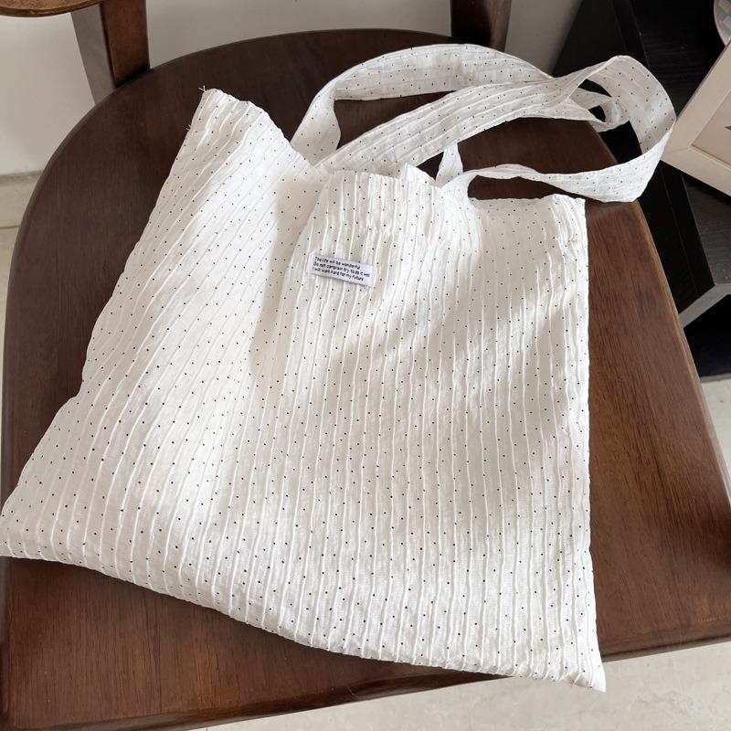 Spring and summer new Tencel texture crepe classic polka dot printing niche shoulder bag ins lazy wind white canvas bag