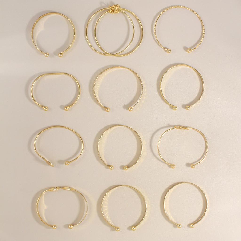 Women's Geometric Pattern Metal Bracelet Set - 12 Pieces, Ancient Craftsmanship, Summer Collection.