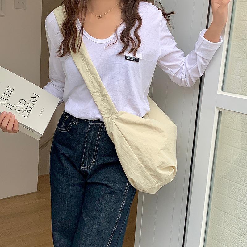 Shoulder bag women's senior sense spring and summer versatile commuter dumpling bag nylon drawstring pleated casual messenger bag women