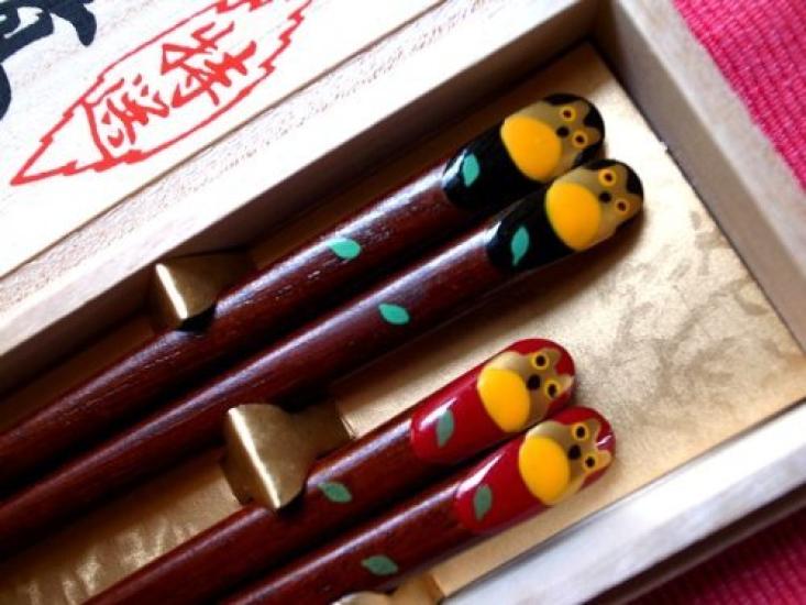 A pair of matching chopsticks featuring a golden owl presented in a paulownia wood A perfect gift for wedding anniversaries wedding Respect for the