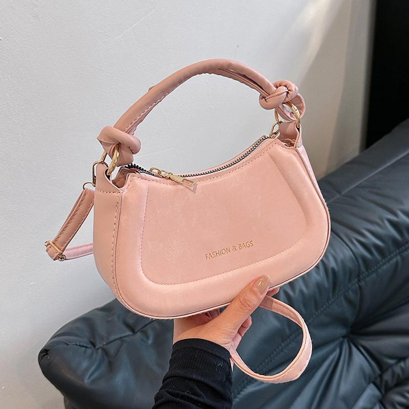 

Niche design bag women s 2024 new fashion retro portable saddle bag texture personalized shoulder messenger bag рожевий