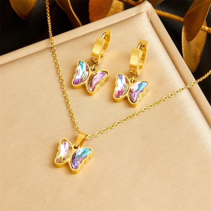 Gold Tone AB Crystal Butterfly Jewelry Set: Necklace and Huggie Earrings золотой