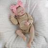 18Inch 46cm Simulated Doll Brown Knitted Rainbow Jumpsuit Pink Bow Headband Vinyl Rebirth Doll Bath Toy Limb Flexibility Doll with Feeding Accessories