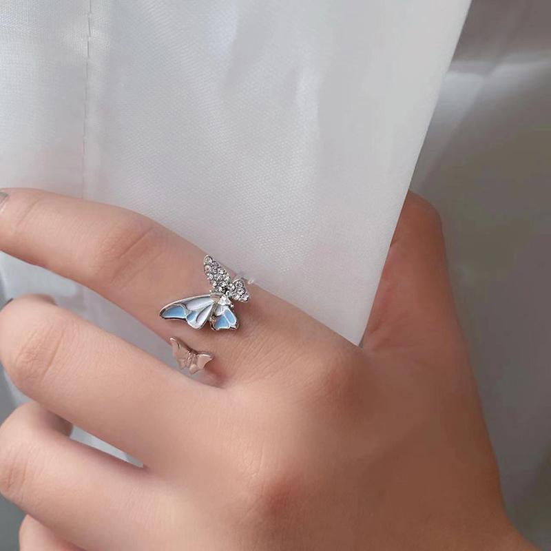 

Синее открытое кольцо с двойной бабочкой и высоким внешним видом. Новое легкое, роскошное, изысканное и универсальное кольцо с усовершенствованным чувством.