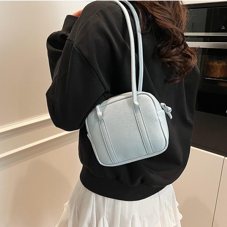 Retro niche portable bowling bag 2025 spring and summer new solid color shoulder bag temperament simple handbag