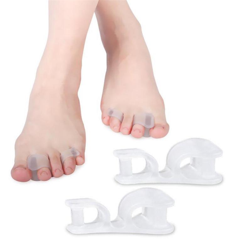 New Good 2Pcs Big Toe Two Hole Thumb Valgus Toe Separator Silicone Gel Foot Fingers Protector Corrector Pedicure Foot Care Tool