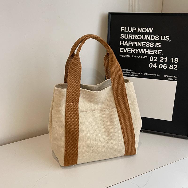 

Сумка-тоут большой вместимости 2025 Иди на работу Выходи в свет Нишевый дизайн Для поездок на работу Простая литература Студенческая одежда Ручная тканевая сумка хаки