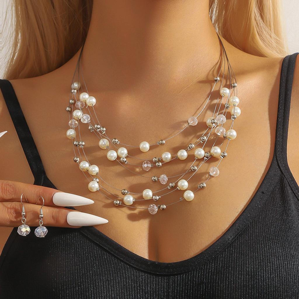 Ensemble bohème rétro pour femme : collier et boucles d'oreilles à plusieurs rangs de cristaux turquoise, style bohème exagéré.