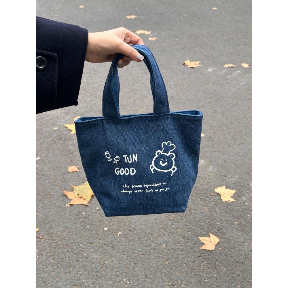 

This year s popular spring and summer new Korean denim illustration bucket bag versatile commuter large capacity hand carry shoulder canvas