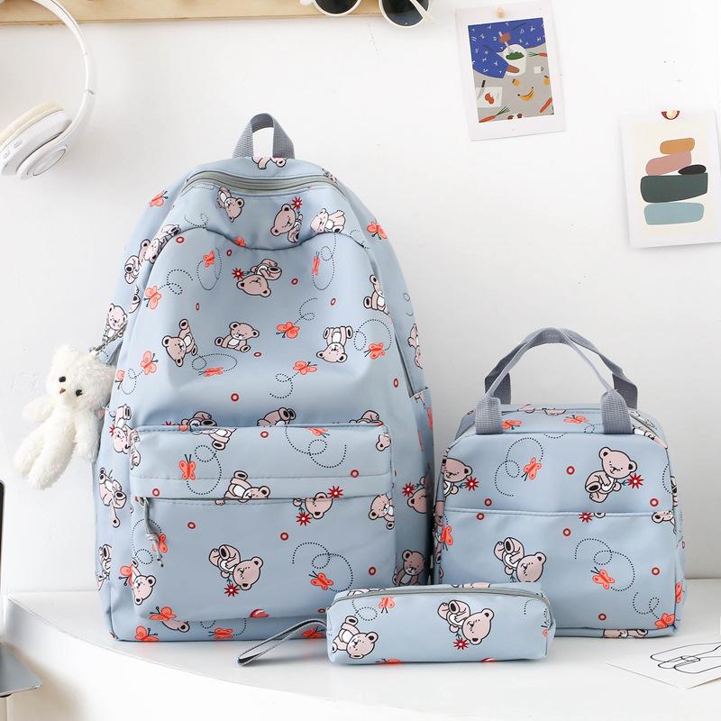 School bag new cute cartoon nylon backpack women's large-capacity middle and high school burden reduction wear-resistant school bag three-piece set