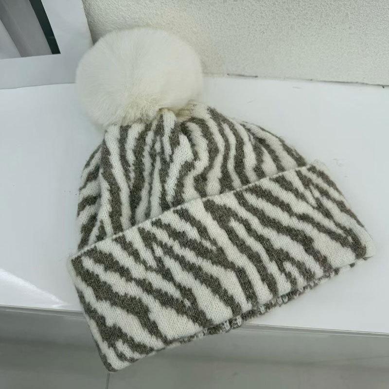 Zebra pattern hairball knitted hat women's autumn and winter retro versatile face small wool hat cold-proof warm ear hat