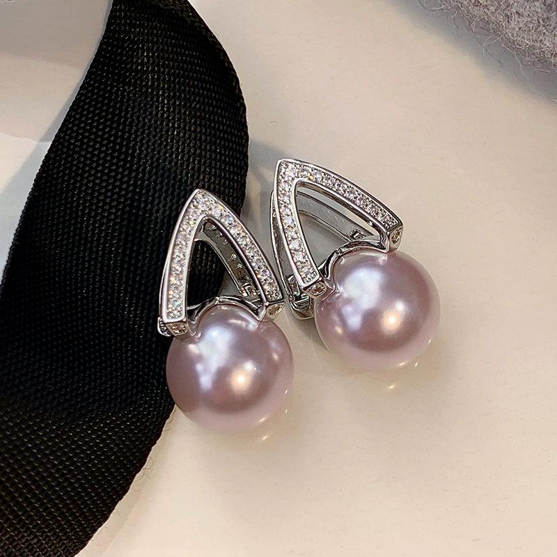 

Pearl earrings women s light luxury high-end horseshoe earrings have atmospheric temperament and unique ear buckles rose purple versatile earrings.