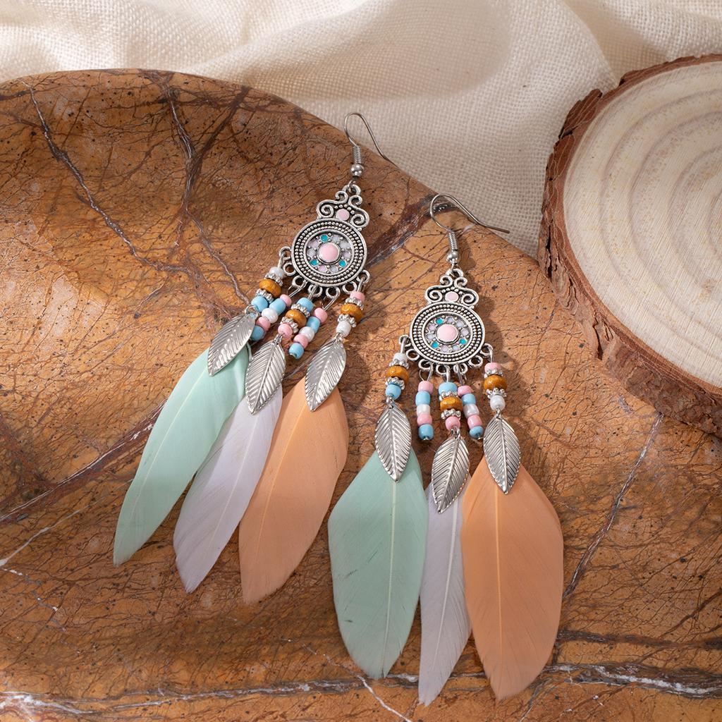 Retro ethnic style woven feathers long fringed earrings, bohemian high-end hollow rice bead earrings