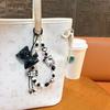 Creative new cat bow beaded mobile phone chain keychain exquisite cute bag pendant small gift wholesale