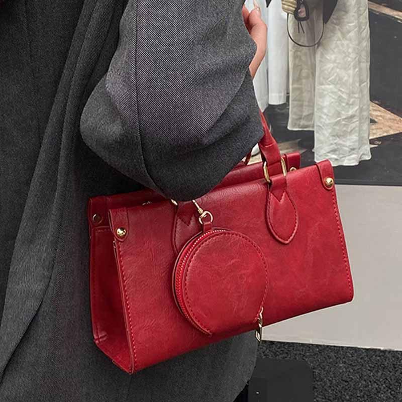 High-end handheld small square bag women's 2025 new retro fashion shoulder bag niche design commuter crossbody bag for women