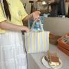 Spring and summer new pleated striped canvas bag portable bento bag storage bag large capacity hand carry