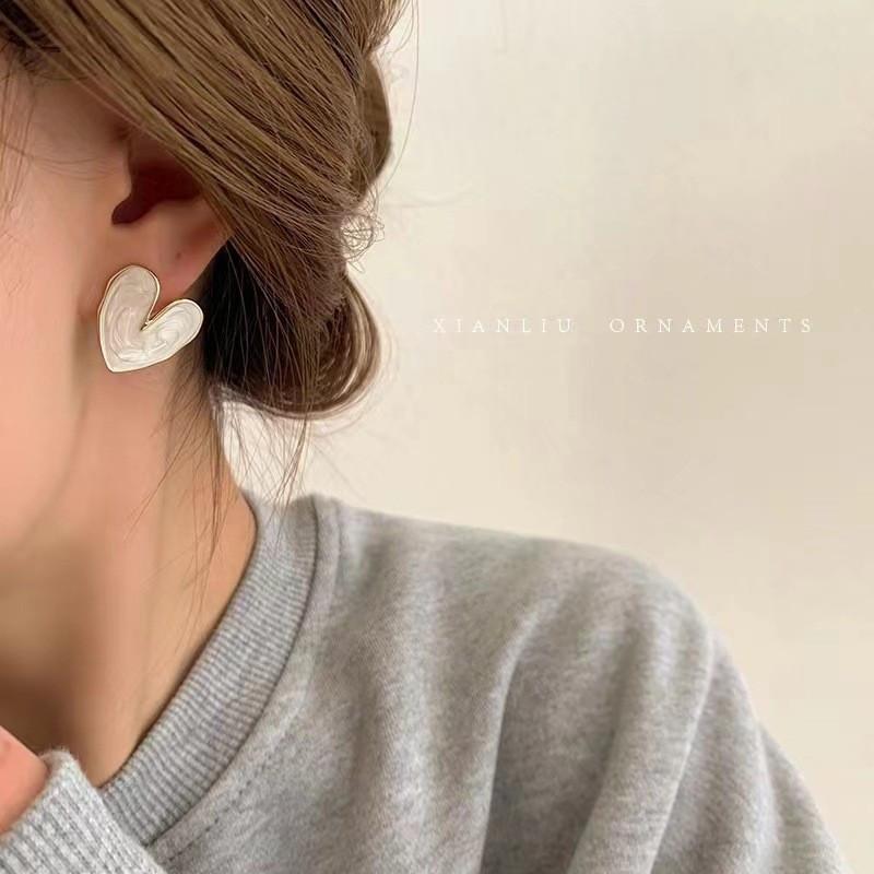 

Серьги-сердечки из циркония белый