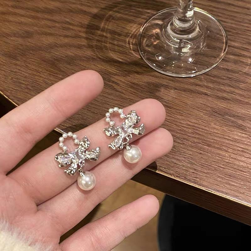 

Bow pearl earrings women s new unique stud earrings autumn and winter high-end niche retro design earrings