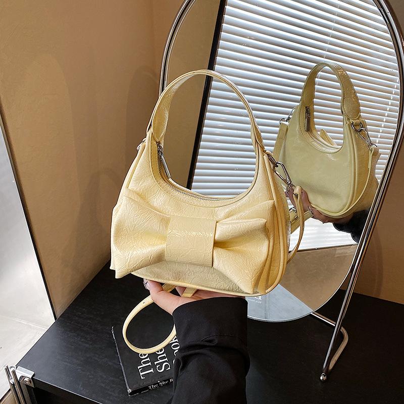 

Small bag women s summer new fashion niche design messenger bag portable dumpling bag жёлтый